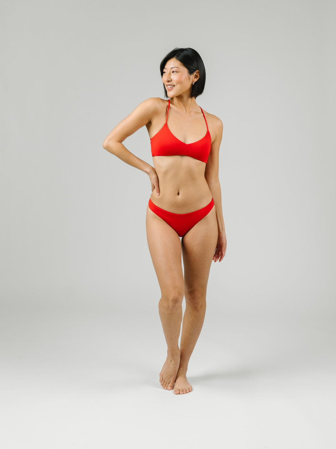 Navalora Swim Scarlett Red Strappy Bikini Top with adjustable criss-cross straps on the back, with matching bottoms, alternate view