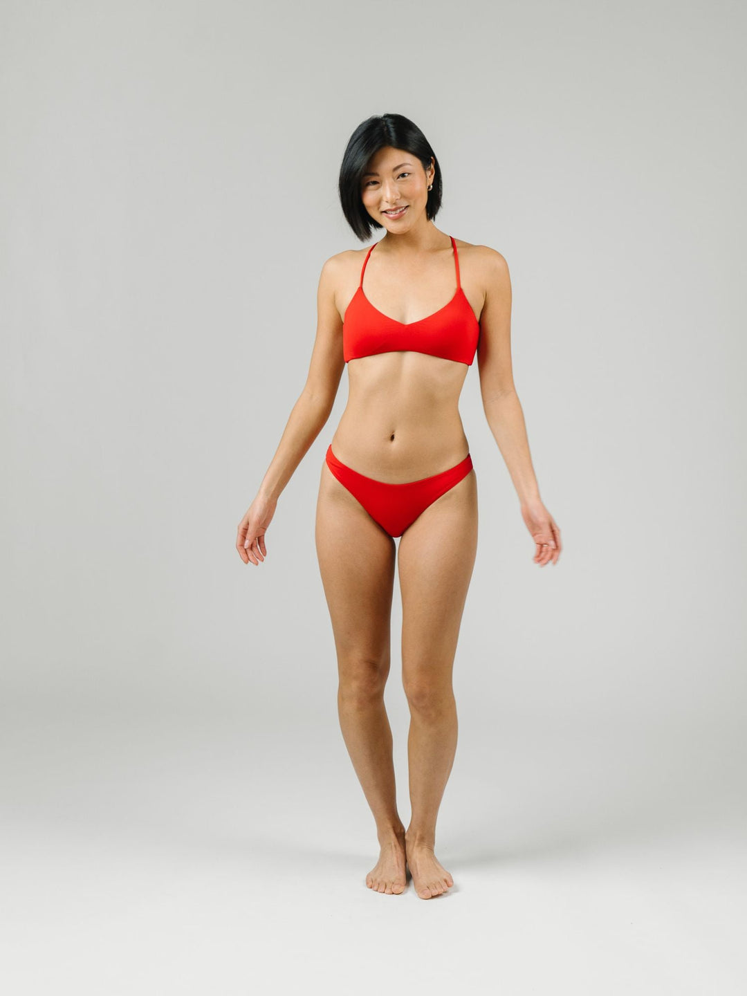 Navalora Swim Scarlett Red Strappy Bikini Top with adjustable criss-cross straps on the back, with matching bottoms